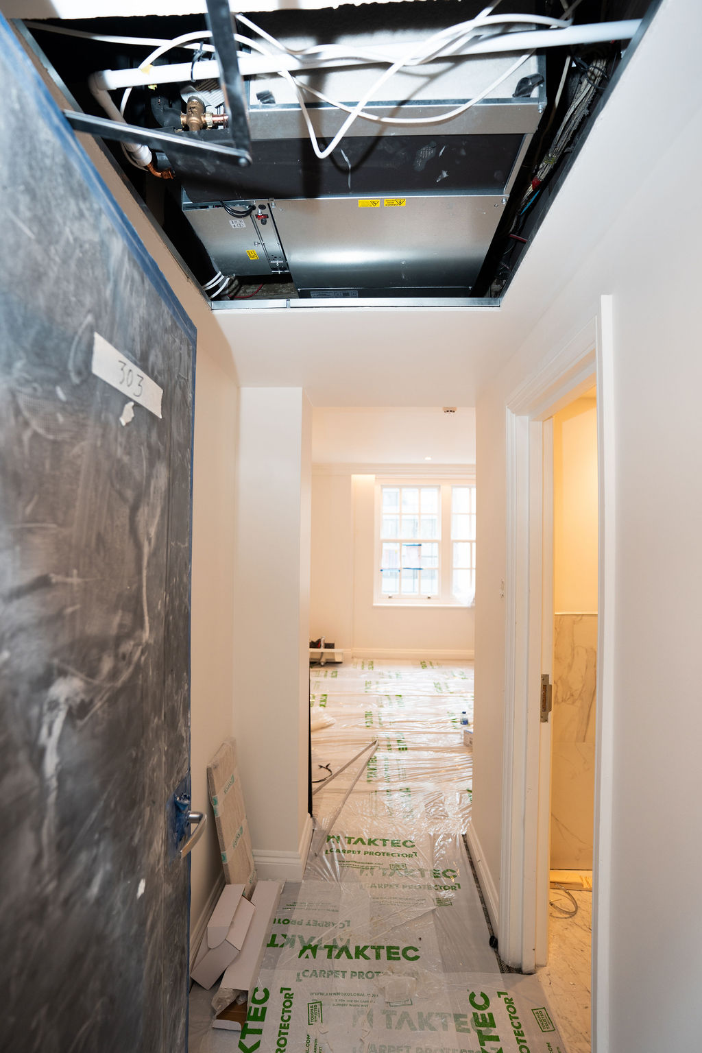 Hallway and bedroom before renovation